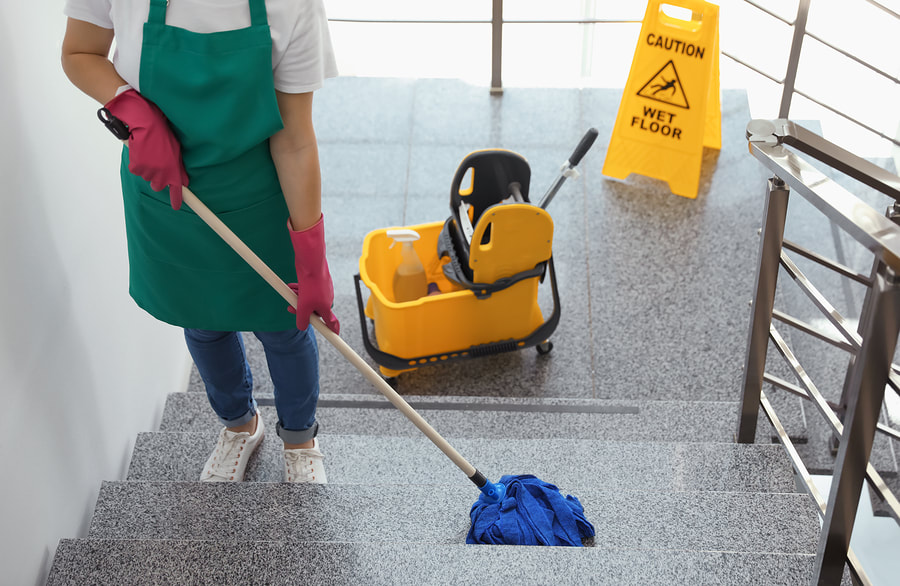 woman mopping the stairs